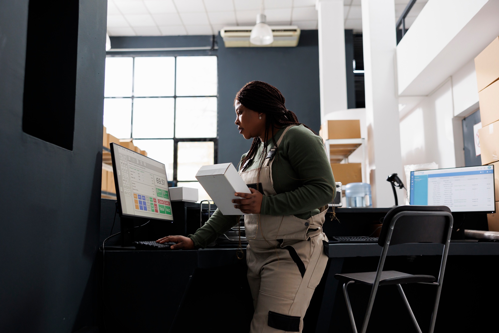 Stockroom employee checking merchandise logistics